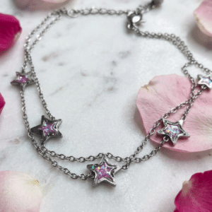 Bracelet étoile rose argenté pailleté Lueur Rosée en acier inoxydable avec paillettes scintillantes