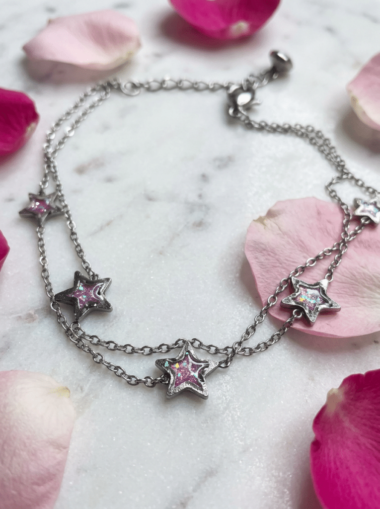 Bracelet étoile rose argenté pailleté Lueur Rosée en acier inoxydable avec paillettes scintillantes